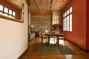 a dining room with a table and chairs at CASA SAUTO Family Suite next to the Cathedral in Mexico City