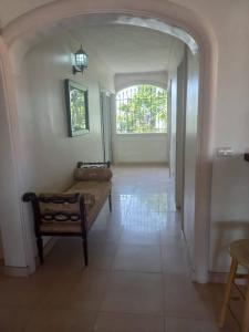 a living room with a couch and a window at casa maria in La Romana