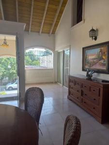 a dining room with a table and chairs at casa maria in La Romana