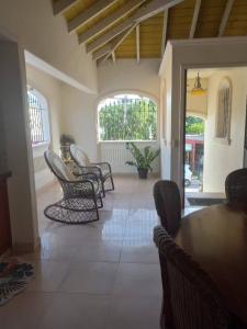 a dining room with chairs and a table in a room at casa maria in La Romana