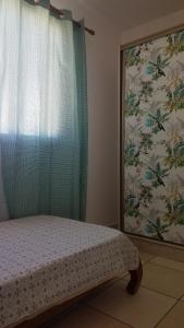 Ліжко або ліжка в номері Les Chandels Appartement avec terrasse vue mer Manapany les bains