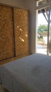 Ліжко або ліжка в номері Les Chandels Appartement avec terrasse vue mer Manapany les bains