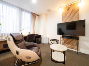 TV a/nebo společenská místnost v ubytování Hotel Tohkai