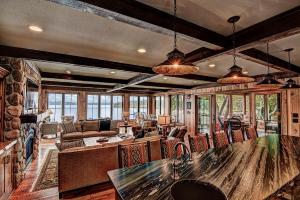 a large living room with a table and chairs at Waterfront Star Lake Cabin, Boat Dock On-Site in Sayner