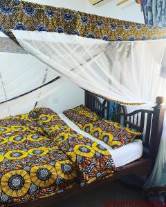 two bunk beds in a room with at Wimbi Cottage in Nungwi