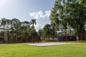 a basketball hoop in a park with a fence at GreenTree Hotel & Extended Stay I-10 FWY Houston, Channelview, Baytown in Channelview +39 photos