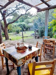 a table with a bowl of food on top of it at Cabaña Privada - Monte y Lucero in San Pablo
