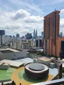 a view of a city from the roof of a building at Infinity pool/ Lucentia BBCC, near LALAPORT, PNB118, KLCC in Kuala Lumpur