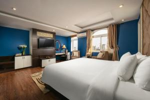 Ένα ή περισσότερα κρεβάτια σε δωμάτιο στο Hanoi 20 Hotel & Apartment