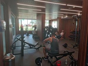 a man sitting on a chair in a gym at Salinas Exclusive Resort in Salinópolis