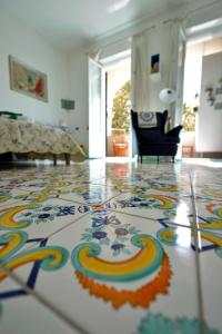 a living room with a colorful rug on the floor at B&B Sognava in Salerno