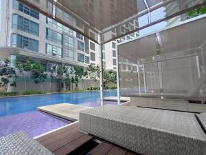 a building with a swimming pool and a building at Eclipse Suites Robertson Bukit Bintang in Kuala Lumpur +25 photos