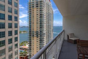 a balcony of a building with a view of the water at Luxury Apartment in Brickell in Miami