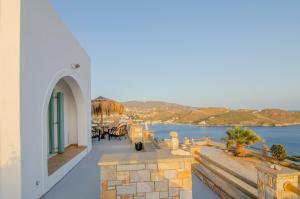 a white building with a view of the water at Ios stylish house Panoramic Sea and Sunset view in Ios Chora