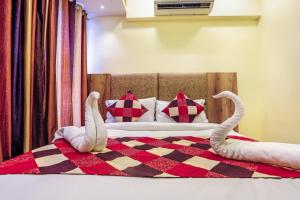 Postel nebo postele na pokoji v ubytování Hotel BKC Corporate Inn