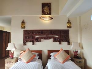 Letto o letti in una camera di Gefecon Villa Ubud