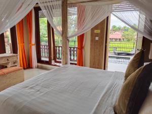 Letto o letti in una camera di Gefecon Villa Ubud