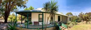 a small house with a gazebo at Fernleigh Accommodation in Goughs Bay