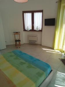 a room with a bed in the middle of a room at Villa Anna Maria in Polignano a Mare