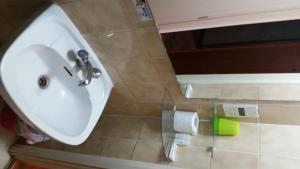 a white sink in a bathroom with at Sylva Hotel in Limassol