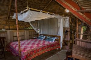 Tempat tidur dalam kamar di Hotel Ambalamanga