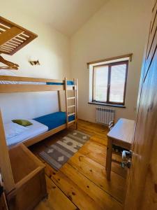 a room with two bunk beds and a table at Green Training Center in Dzoraghpʼyur