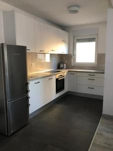 Kuchyňa alebo kuchynka v ubytovaní Apartment SKYE