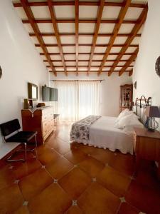 En eller flere senge i et værelse på Villa Victoria