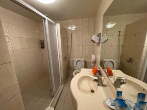 a bathroom with a toilet and a sink and a shower at Fuyam tourist home in Hualing