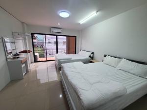 Postel nebo postele na pokoji v ubytování Khoksametchun Hostel