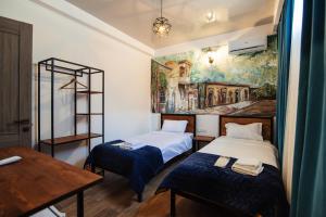 Hotel Boutique George 객실 침대