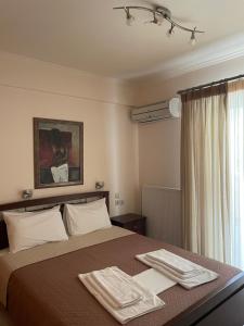 Кровать или кровати в номере Dais Apartments