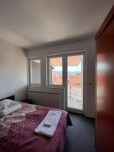 Letto o letti in una camera di Hotel Begić