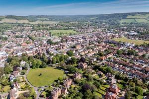 an aerial view of a small town with houses at The Waltons in Dorking