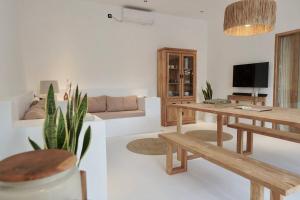a living room with wooden tables and a couch at Villa Enda in Dalung