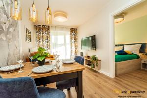 Telewizja i/lub zestaw kina domowego w obiekcie Baltic Apartments - Sun Towers
