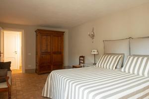 Postel nebo postele na pokoji v ubytování Villa Capalbio