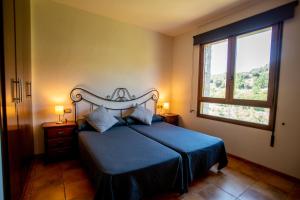 Postel nebo postele na pokoji v ubytování Hostal El Guerrer