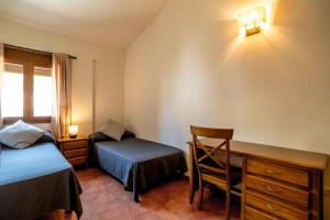 Postel nebo postele na pokoji v ubytování Hostal El Guerrer