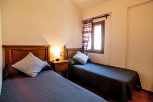 Postel nebo postele na pokoji v ubytování Hostal El Guerrer