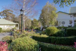 a house with a street light in a garden at Yarra Gables in Healesville