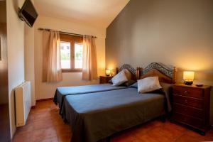 Postel nebo postele na pokoji v ubytování Hostal El Guerrer