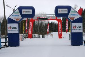 a group of signs in the snow next to a bridge at Tamsalu Spordikompleksi Hostel in Tamsalu