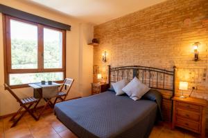 Postel nebo postele na pokoji v ubytování Hostal El Guerrer