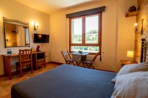Postel nebo postele na pokoji v ubytování Hostal El Guerrer