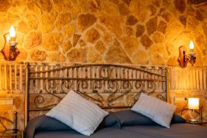 Posteľ alebo postele v izbe v ubytovaní Hostal El Guerrer