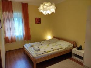 Posteľ alebo postele v izbe v ubytovaní Révai Apartman Fonyód