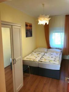 Posteľ alebo postele v izbe v ubytovaní Révai Apartman Fonyód