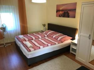 Posteľ alebo postele v izbe v ubytovaní Révai Apartman Fonyód