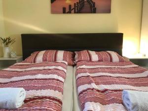 Posteľ alebo postele v izbe v ubytovaní Révai Apartman Fonyód